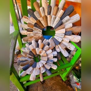 Two wooden flower-like outside hanging decor painted made to look worn very nice